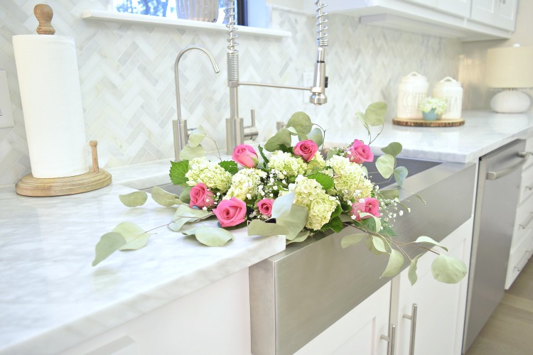 flowers in the sink hydrangeas pink roses