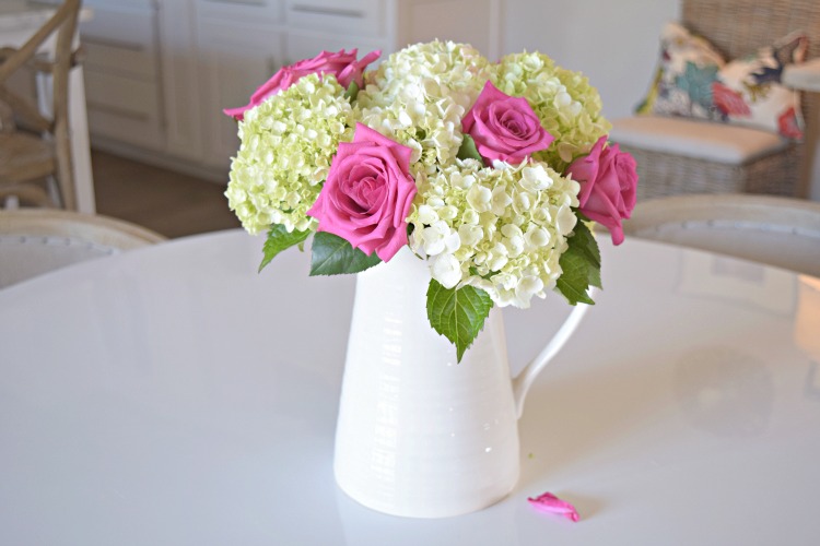 pink roses baby white hydrangeas boquet white pitcher