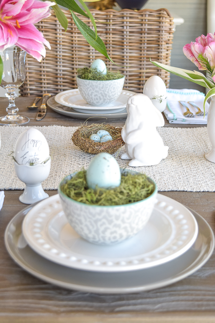 Easter table bunnies dishes flowers tablescape