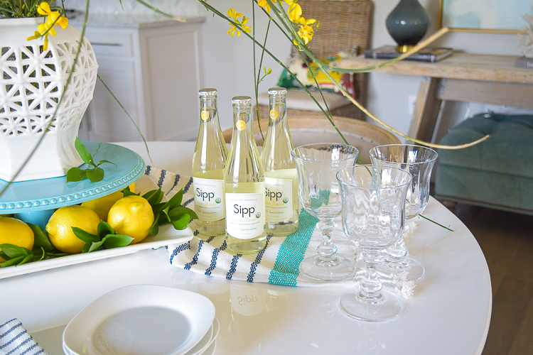 White vase spring summer dishes aqua cake stand forsythia yellow flower bush brunch lemons table scape center piece_-10