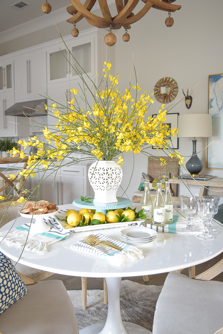 White vase spring summer dishes aqua cake stand forsythia yellow flower bush brunch lemons table scape center piece_-15