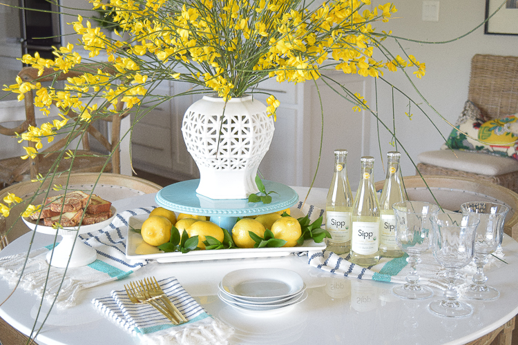 White vase spring summer dishes aqua cake stand forsythia yellow flower bush brunch lemons table scape center piece_-2