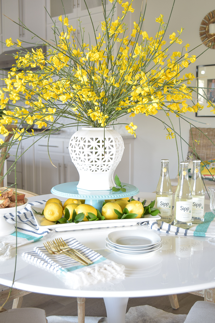 White vase spring summer dishes aqua cake stand forsythia yellow flower bush brunch lemons table scape center piece_-4