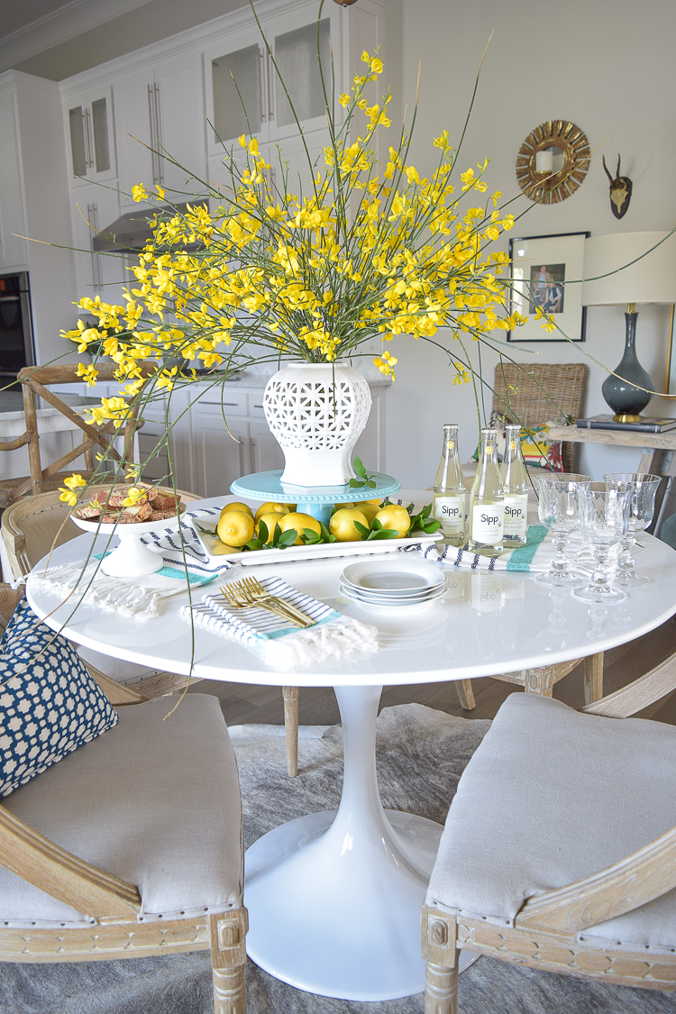 White vase spring summer dishes aqua cake stand forsythia yellow flower bush brunch lemons table scape center piece_-5