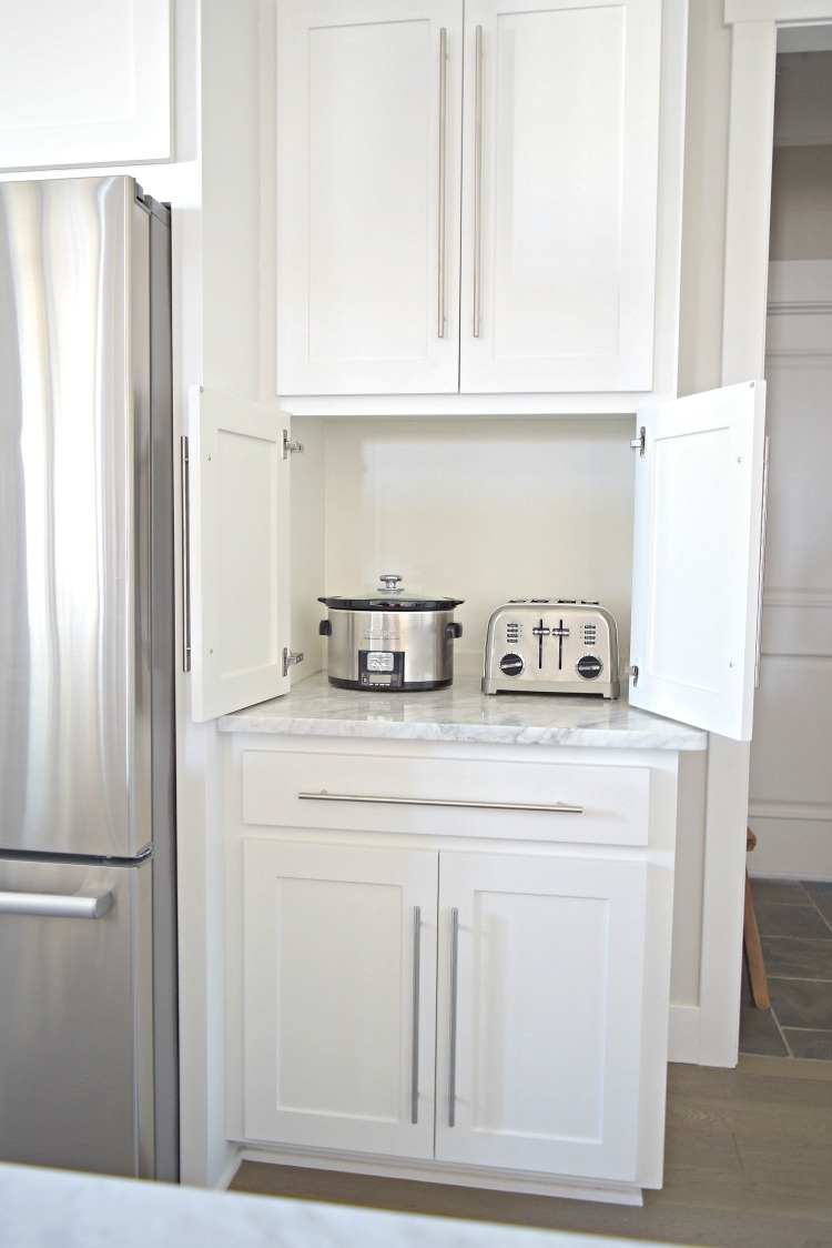 white kitchen carrara marble counter tops appliance cabinet