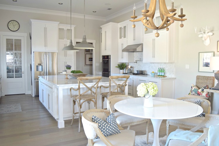 white kitchen carrara marble herringbone backsplash