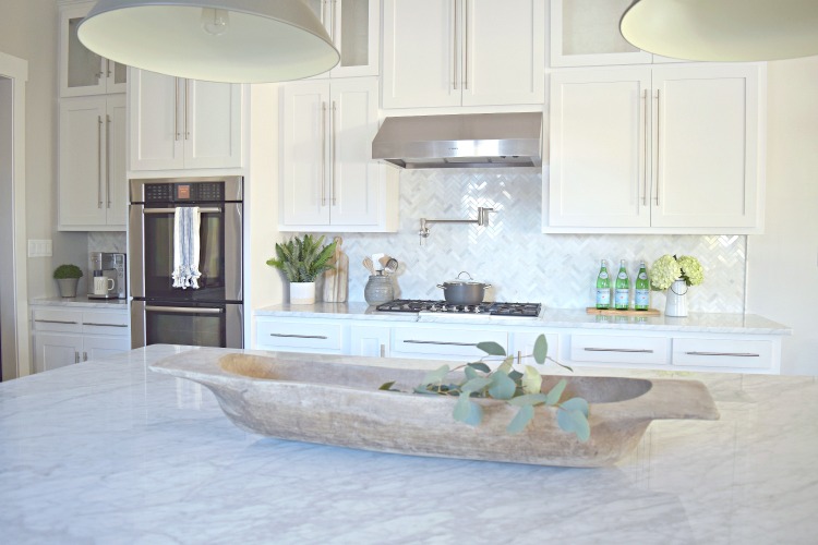 white kitchen dough bowl carrara marble shaker white cabinets