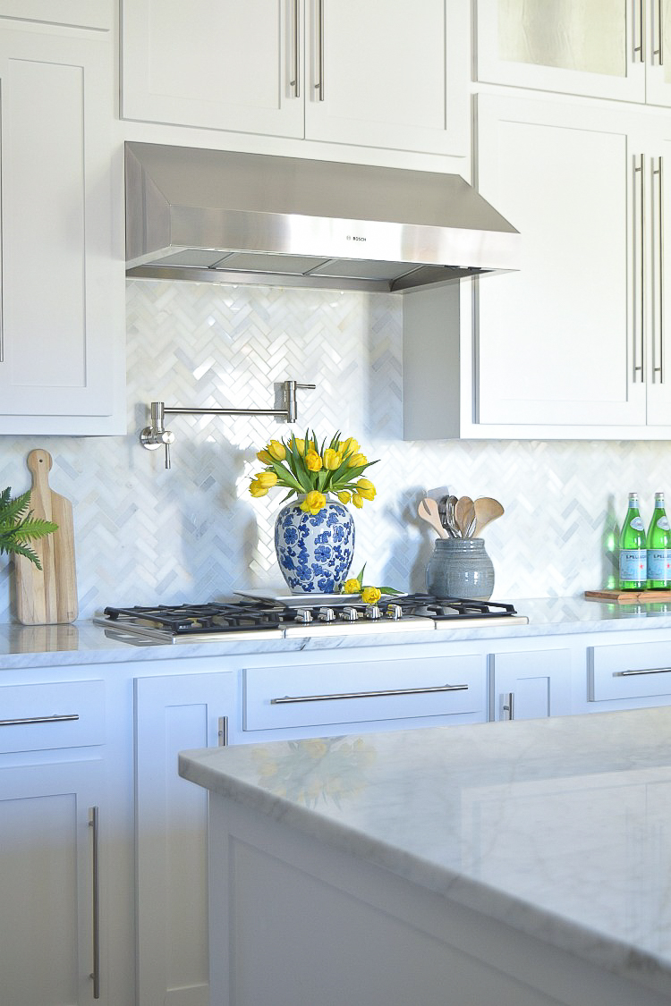 white carrara marble herringbone backsplash8