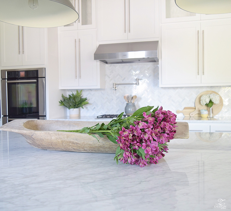 dark pink alstromeria flowers in a bread bowl