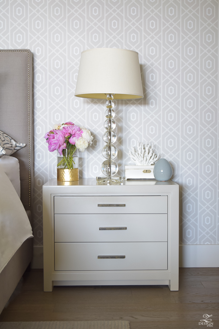 pink and white peonies next to bed geometric thibaut wallpaper_