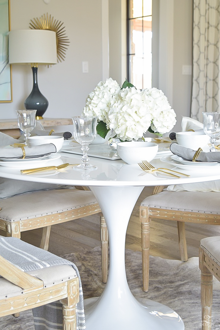 white tulip table with bring white table scape