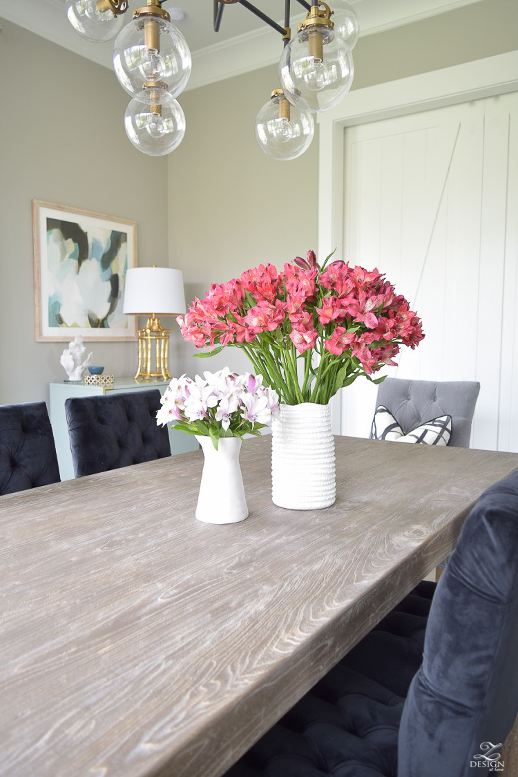 transitional dining room with rustic table and modern chandelier-1