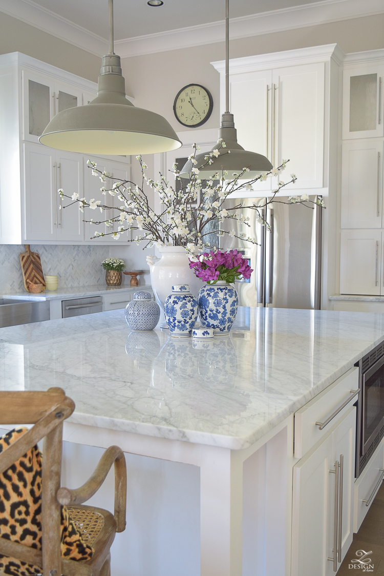  Kitchen-Island-styling-ideas-with-collection-of-vases-white-carrara-marble-farmhouse-pendants-chinoserie-blue-and-white-vases-