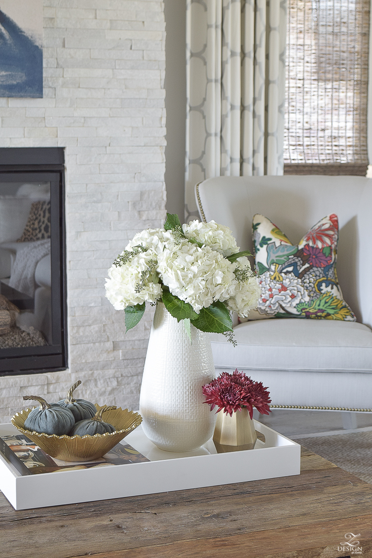 white-transitional-fall-living-room-chiang-mia-dragon-fabric-pillow-leaopard-pillows-fur-stools-kravet-riad-curtains-5