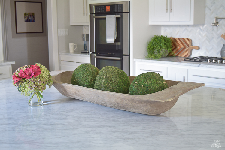 carrara-marble-kitchen-island-bread-bowl-moss-balls-white-farmhouse-kitchen-herringbone-backsplash-