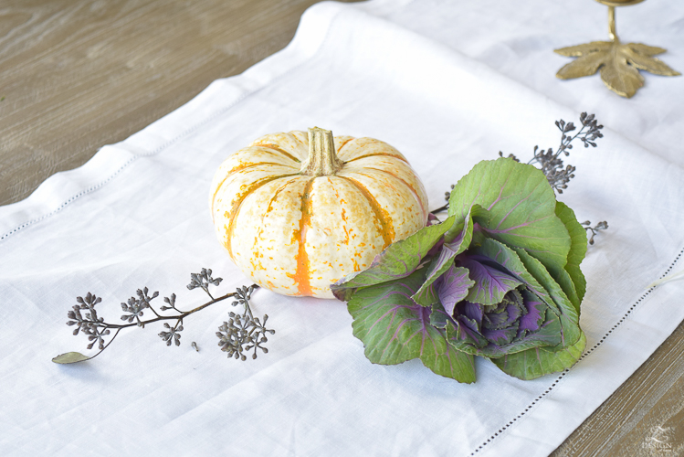 easy-fall-pumpkin-centerpiece-white-linen-table-runner-brass-leaf-candlesticks-dining-room-3