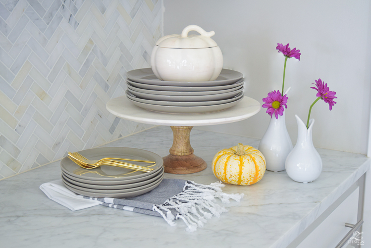 modern-fall-decor-in-the-kitchen-white-carrara-countertops-white-carrara-herringbone-backsplash-brass-pot-white-pumkins-6