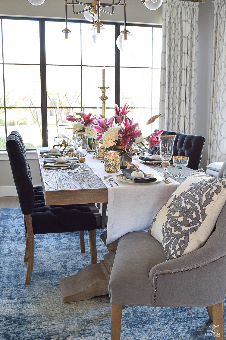 thanksgiving-table-scape-black-velvet-chairs-vintage-inspired-blue-rug-kravet-riad-curtains-gray-washed-dining-table-white-hydrangeas-plum-lillies-2