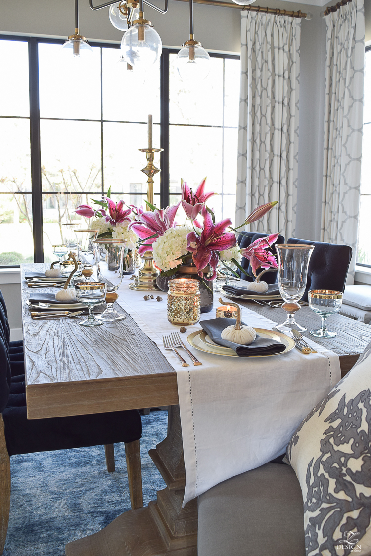 thanksgiving-table-scape-black-velvet-chairs-vintage-inspired-blue-rug-kravet-riad-curtains-gray-washed-dining-table-white-hydrangeas-plum-lillies-4