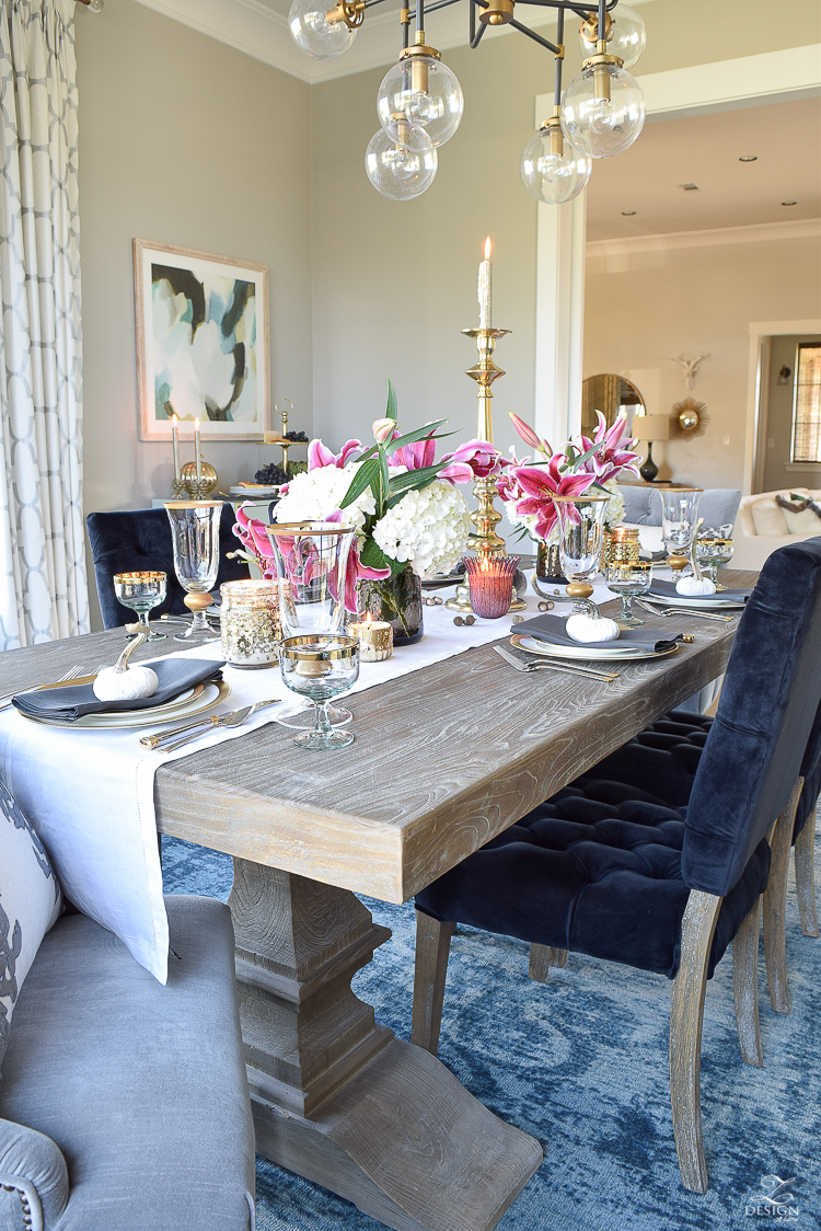 thanksgiving-table-scape-black-velvet-chairs-vintage-inspired-blue-rug-kravet-riad-curtains-gray-washed-dining-table-white-hydrangeas-plum-lillies-6