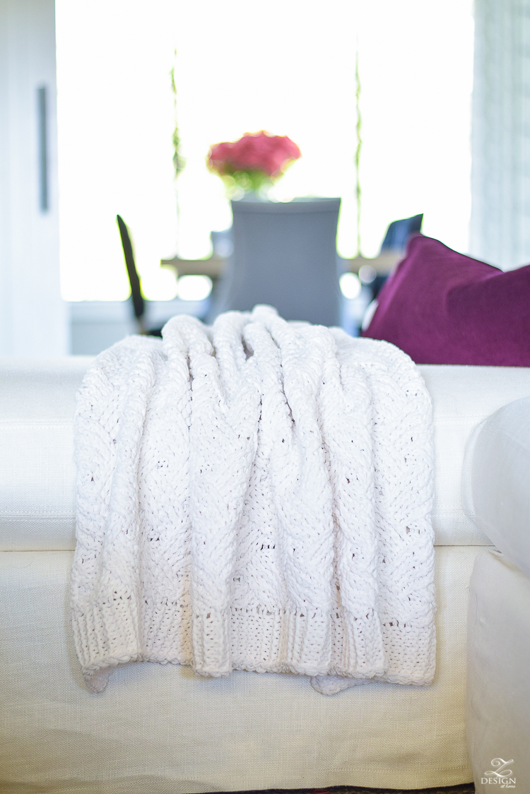 white-transitional-fall-living-room-chiang-mia-dragon-fabric-pillow-leaopard-pillows-fur-stools-kravet-riad-curtains-3