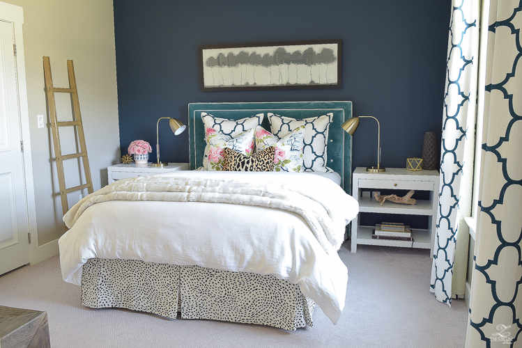 cozy-chic-bedrrom-gold-ladder-navy-wall-gentlemans-gray-white-modern-side-tables-teal-headboard-kravet-riad-navy-fabric-pillows-curtains-gray-carpet-best-gold-spray-paint-2