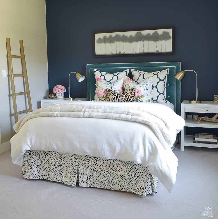 cozy-chic-bedrrom-gold-ladder-navy-wall-gentlemans-gray-white-modern-side-tables-teal-headboard-kravet-riad-navy-fabric-pillows-curtains-gray-carpet-best-gold-spray-paint-3