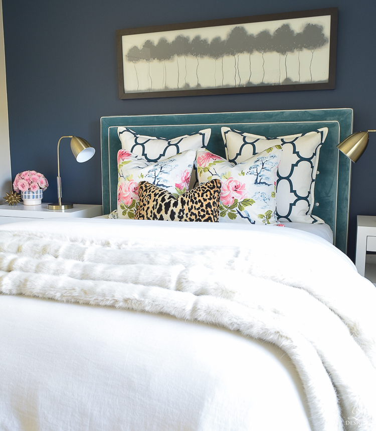 custom-bedskirt-dalmation-fabric-white-faux-fur-throw-benjamin-moore-gentlemans-gray-paint-floral-and-leopard-pillows-white-linen-bedding-brass-lamps-4