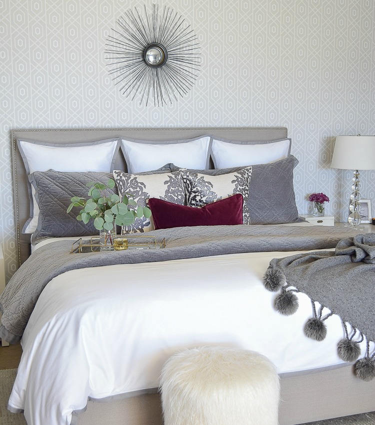 neutral-gray-and-white-bedroom-geometric-wallpaper-gray-nightstands-white-bedding-with-gray-border-gray-velvet-quilt-and-shams-1