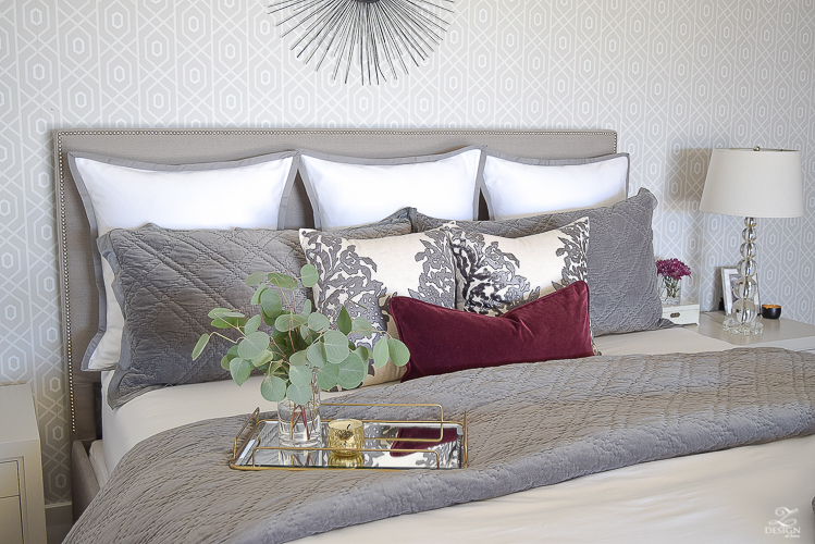 neutral-gray-and-white-bedroom-geometric-wallpaper-gray-nightstands-white-bedding-with-gray-border-gray-velvet-quilt-and-shams-15