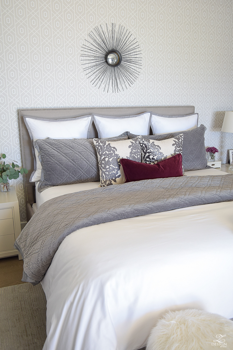 neutral-gray-and-white-bedroom-geometric-wallpaper-gray-nightstands-white-bedding-with-gray-border-gray-velvet-quilt-and-shams-17