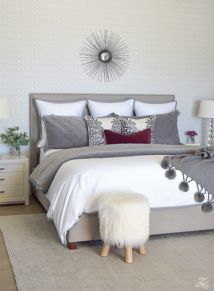 neutral-gray-and-white-bedroom-geometric-wallpaper-gray-nightstands-white-bedding-with-gray-border-gray-velvet-quilt-and-shams-18