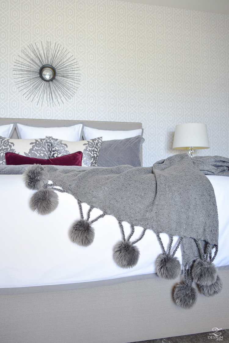 neutral-gray-and-white-bedroom-geometric-wallpaper-gray-nightstands-white-bedding-with-gray-border-gray-velvet-quilt-and-shams-3