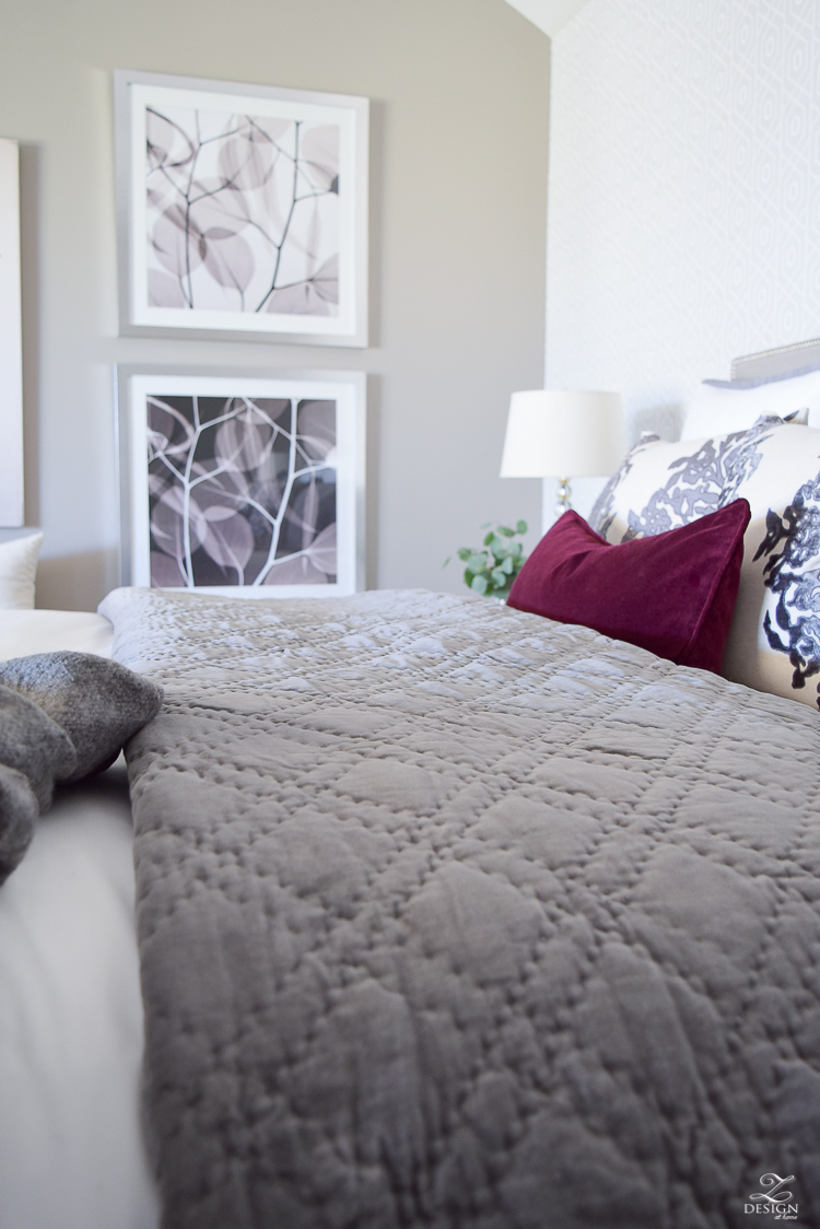 neutral-gray-and-white-bedroom-geometric-wallpaper-gray-nightstands-white-bedding-with-gray-border-gray-velvet-quilt-and-shams-7