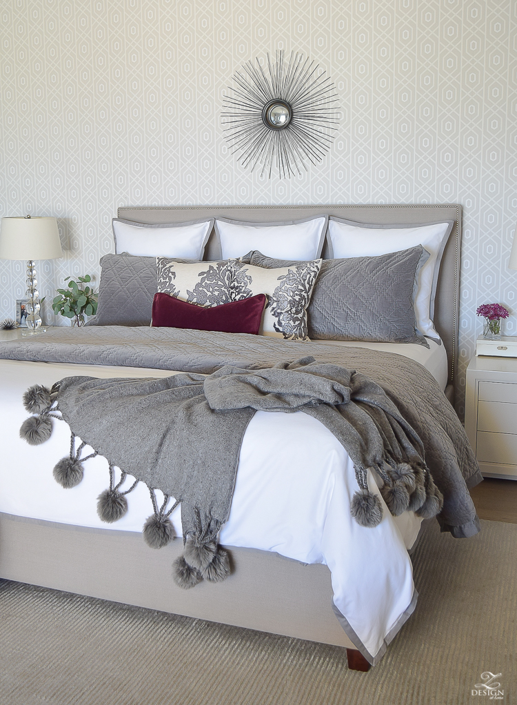 white-bedding-with-gray-border-geometric-wallpaper-pom-pom-throw-neurtral-bedroom-winter-bedroom-white-bedroom-1