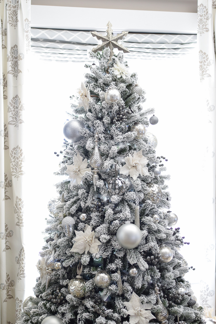 christmas-home-tour-king-of-christmas-flocked-tree-modern-gift-wrap-mercury-glass-ornaments-sheep-skin-rug-tree-skirt-white-and-jeweled-ornaments-6