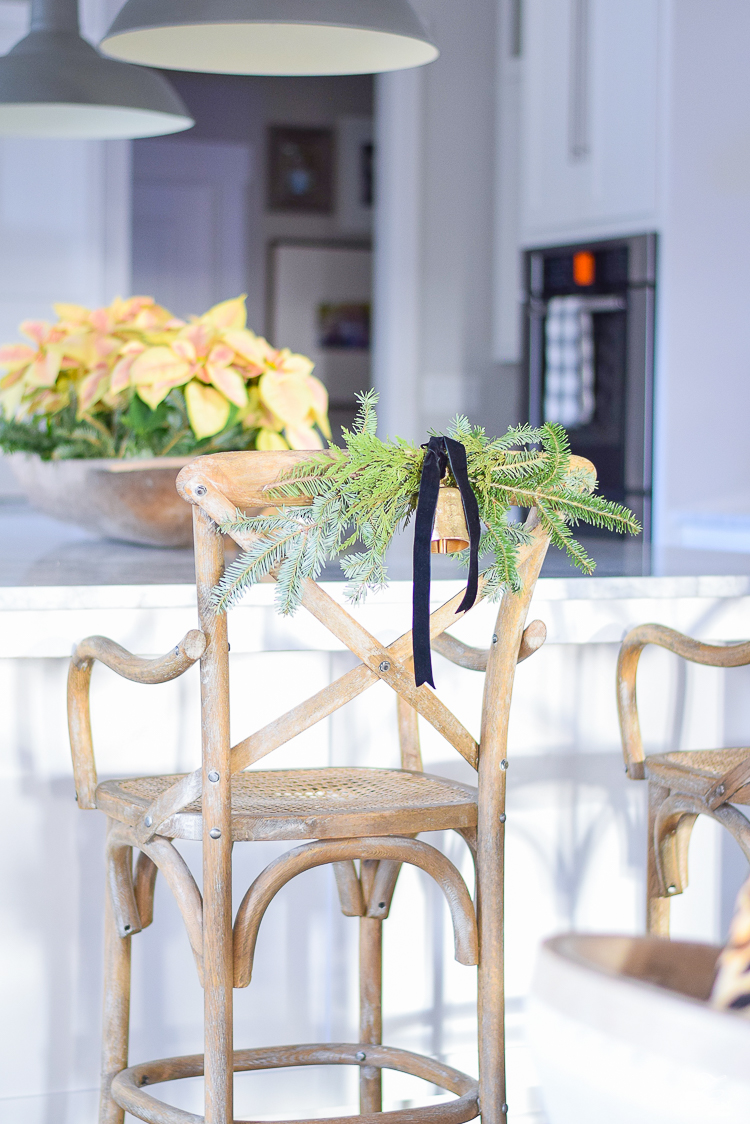 christmas-swag-on-back-of-chair-white-modern-farmhouse-kitchen-with-white-carrar-marble-1