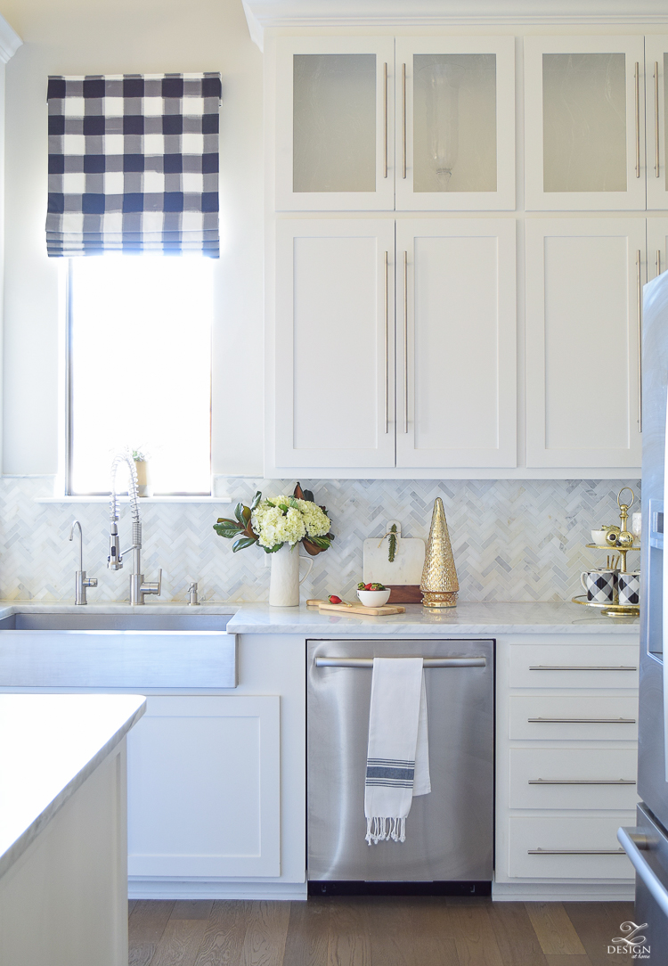 the-drawn-company-faux-roman-shade-with-caitlin-wilson-buffalo-check-fabric-white-farmhouse-kitchen-with-white-carrara-marble-and-herringbone-backsplash-4