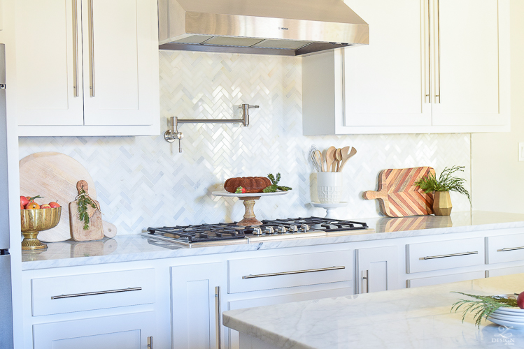 modern-white-farmhouse-kitchen-white-carrara-marble-countertops-and-backsplash-vintage-barn-pendants-christmas-kitchen-decor-3