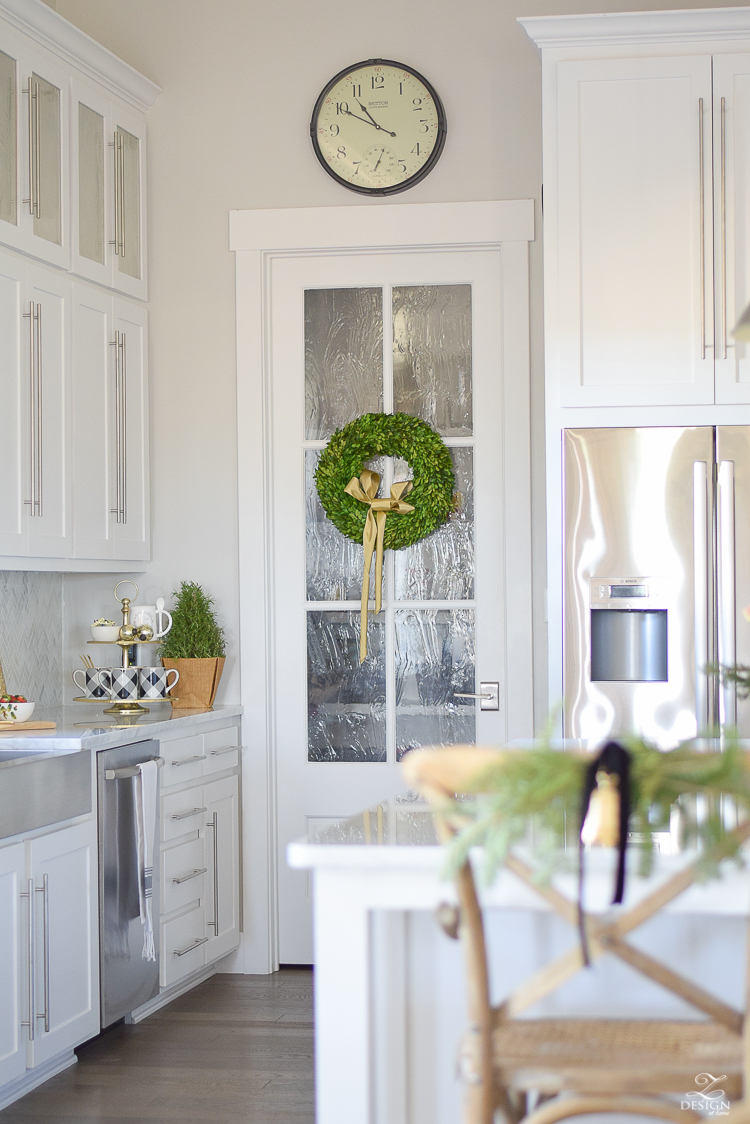 white-modern-farmhouse-kitchen-with-white-carrara-marble-and-white-herringbone-backsplash-christmas-deocr-for-the-kitchen-vintage-barn-pendants-large-dough-bowl-14