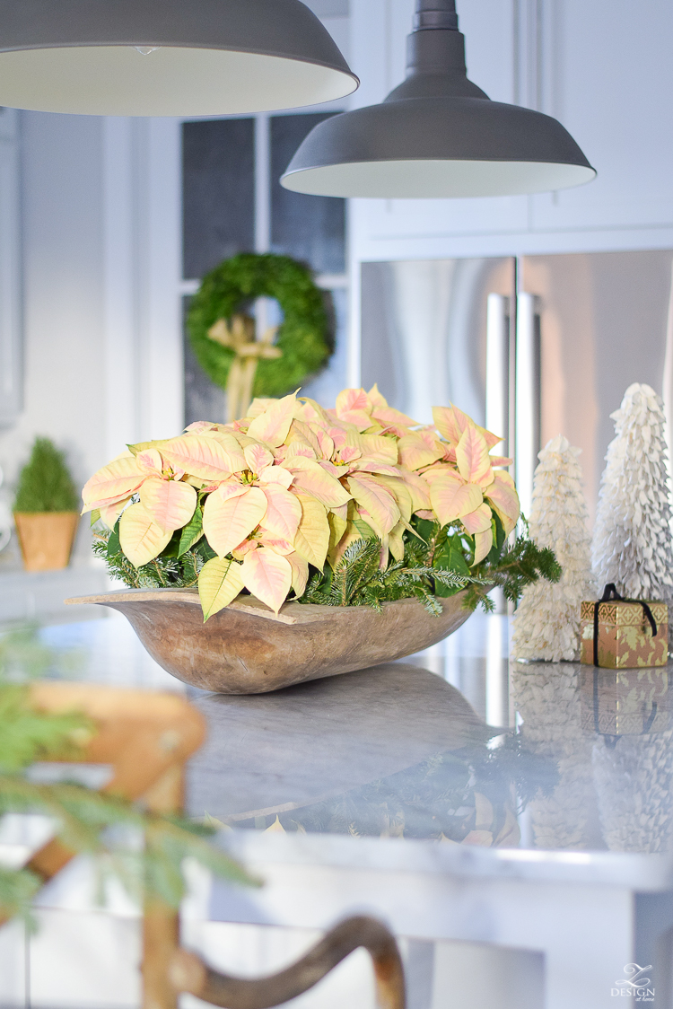 Poinsettias in large bread bowl in white farmhouse kitchen - Christmas Kitchen Tour