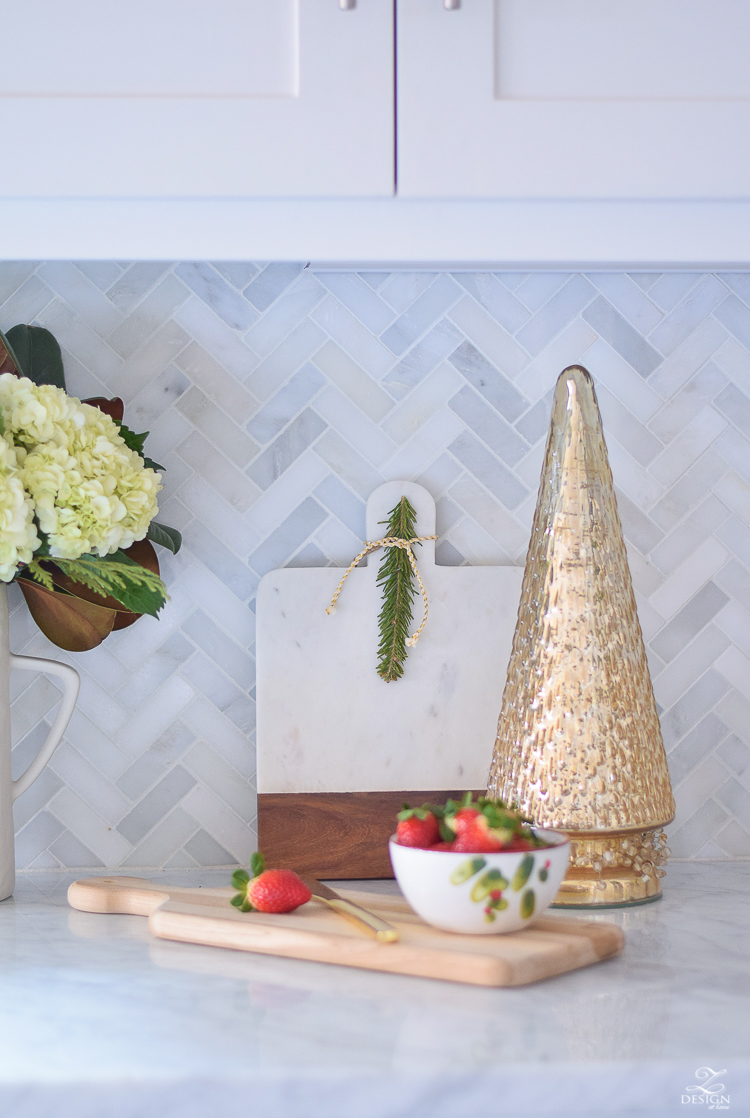 white-modern-farmhouse-kitchen-with-white-carrara-marble-and-white-herringbone-backsplash-christmas-deocr-for-the-kitchen-vintage-barn-pendants-large-dough-bowl-9