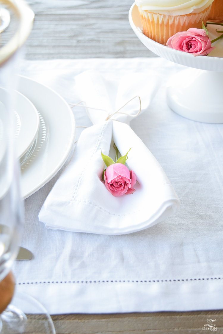 Soft and simple valentines table scape pink rose wrapped in white napkin tied with string white linen table runner-1