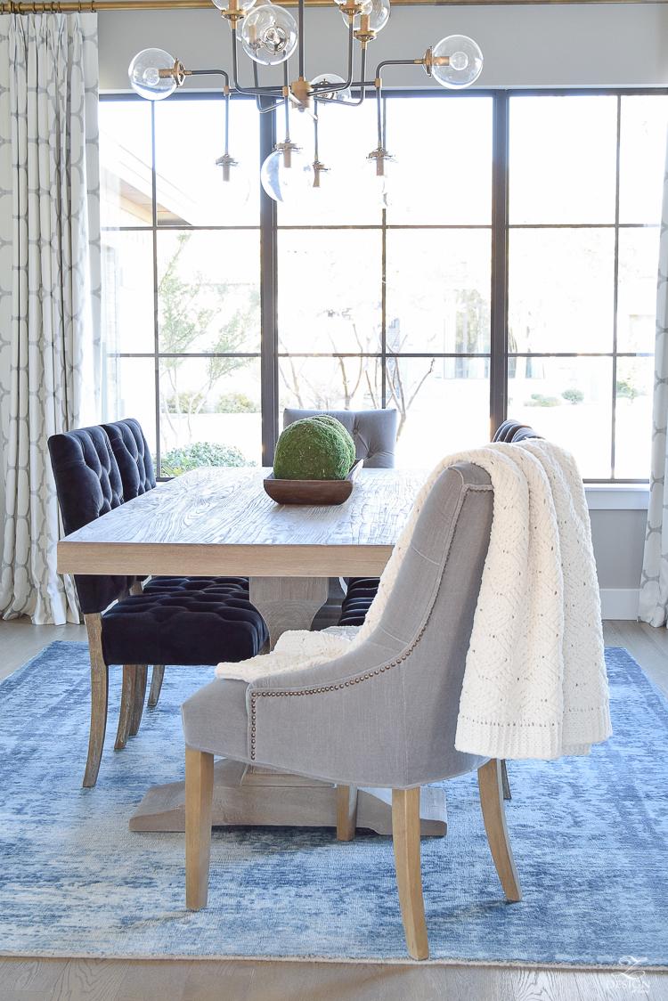 ransitional modern dining room gray tufted dining chair black tufted dining chair blue vintage inspired rug kravet riad curtains sherwin williams mindful gray paint-1