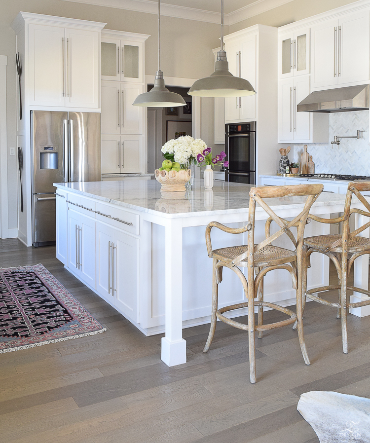 white farmhouse kitchen zdesign at home spring tour vintage barn pendants caitlin wilson rugs gray wood floors white cabinets SW on the rocks paint-1