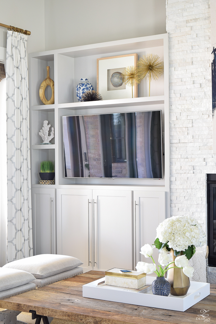 zdesign at home spring tour west elm blue patterned vase brass faceted vase white acrylic tray book shelf styling bone box white hydrangeas and tulips-1