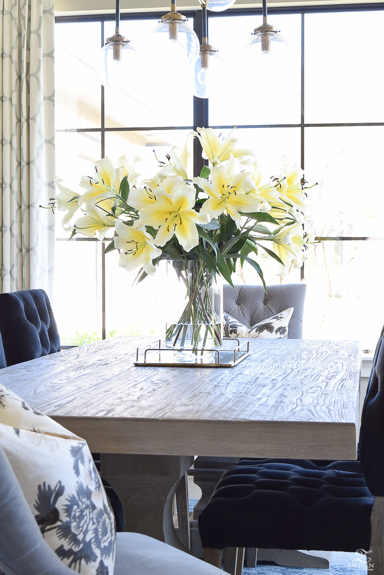 make your home feel cozy and inviting with flowers white bathroom transitional dining room gray rustic table marble backsplash yellow lilies