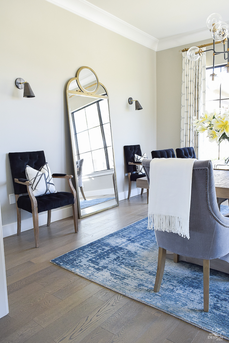 tip to make your home feel cozy and inviting with curtains, flowers and art blue vintage inspired rug black tufted dining chairs kravet riad custom curtains sw mindful gray-2