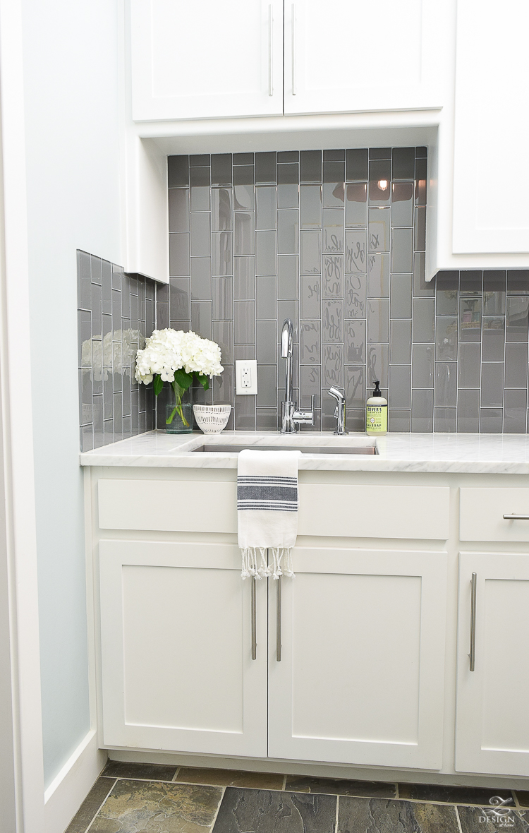 Beautiful laundry room ideas danze kitchen faucet stainless laundry room sink gray subway tile installed vertically white shaker cabinets large stainless bar pulls