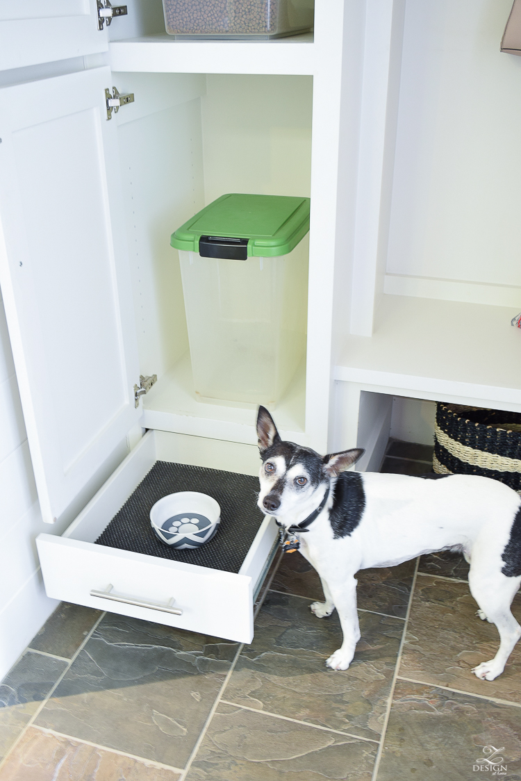 small mud room with pet storage and organization for dog food dog food bowl in drawer white shaker cabinets-4